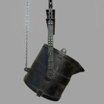 Foundry metal bucket hanging on chain