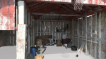 Old wooden garage with materials