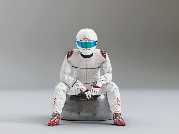 Pilot man in racing suit on metal ball