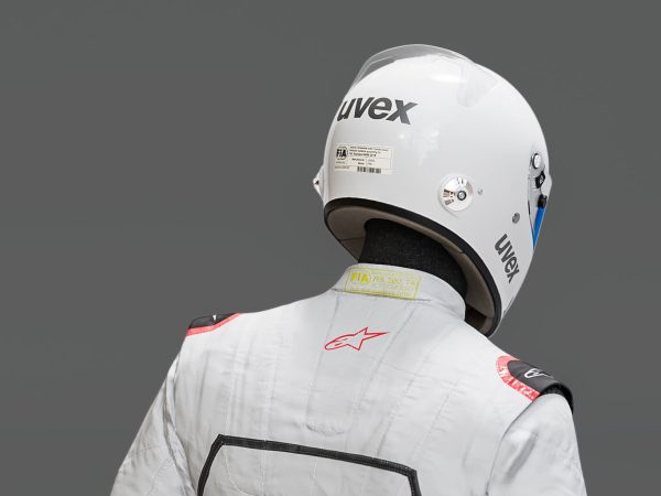 Pilot man in racing suit on metal ball