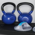 Sports set two dumbbells on mat