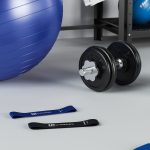 Sports set two dumbbells on mat